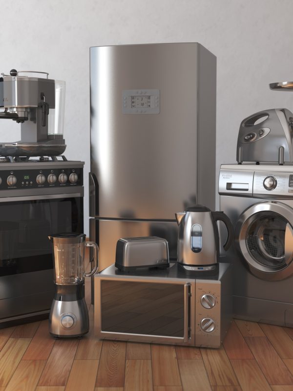 Home appliances. Household kitchen technics in the empty room Home appliances. Household kitchen technics in the empty room